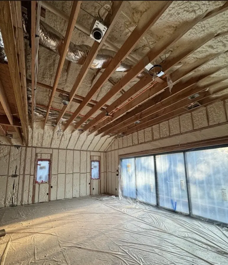 Interior walls and ceiling insulated with spray foam during new construction in McComb